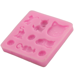 Pink silicone mold featuring multiple playful cat patterns and yarn balls for DIY baking