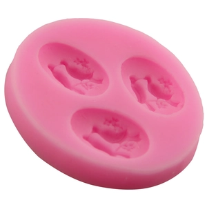Pink 3D silicone mold with 3 holes featuring bird and swan relief for cake fondant decorating