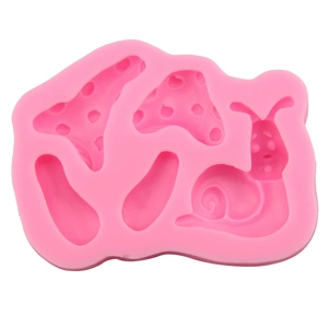 Pink silicone mold with mushroom and snail shapes for cake decorating and DIY chocolate craft