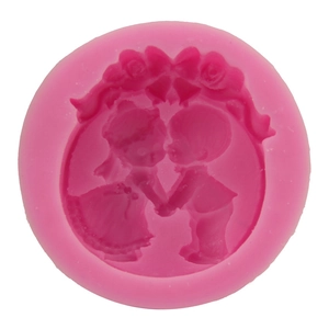 Pink silicone mold featuring a romantic boy and girl relief for DIY fondant cake baking