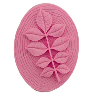 Pink oval silicone fondant mold featuring elegant leaf relief and wavy texture pattern