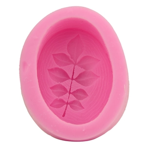 Pink silicone fondant mold featuring elegant pinnate leaf patterns for DIY baking
