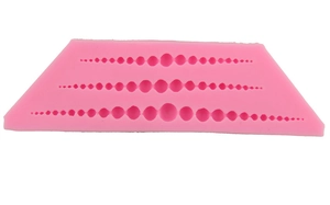 Pink silicone fondant mold with three rows of pearl bead patterns for DIY cake decoration