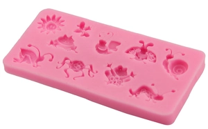 Pink silicone fondant mold featuring flowers and insects for DIY cake baking and chocolate