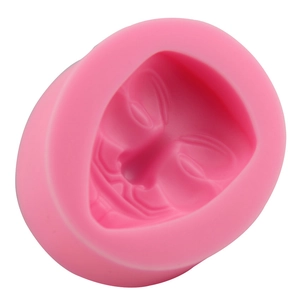 Pink silicone fondant mold featuring a detailed V for Vendetta face mask design