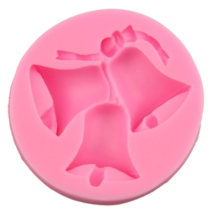 Christmas themed round pink silicone mold featuring three bell shapes for DIY baking