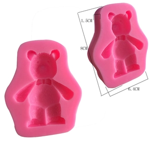 Detailed dimensions of a 3D teddy bear silicone mold with a pink bow tie for DIY crafts