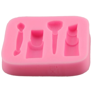 Pink silicone fondant mold featuring lipstick and makeup brush shapes for cake decorating