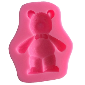 Detail view of pink 3D bear silicone mold with bow for fondant and DIY crafts