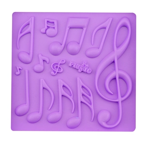 Purple silicone music symbol fondant mold with treble clef and music letter designs