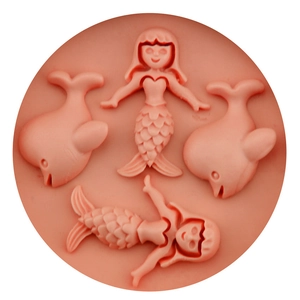 Pink silicone mold featuring mermaid and dolphin shapes for DIY fondant and baking