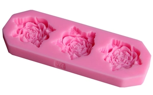 Pink silicone mold with three rose flower cavities for fondant cake decoration
