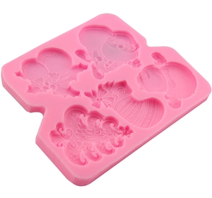 Pink silicone mold featuring Santa Claus, Christmas tree and snowman for fondant cakes