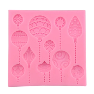 Pink silicone Christmas ornament mold with 10 slots for chocolate and fondant baking