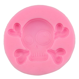 Pink round silicone skull mold with heart-shaped eye and crossbones for DIY baking