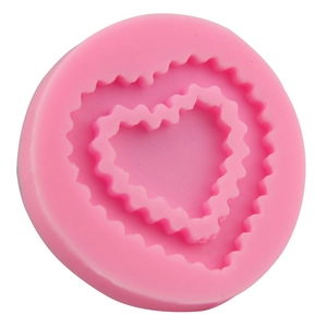 Pink heart-shaped silicone mold with wave edges for fondant and chocolate cake decoration