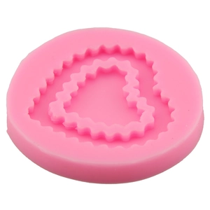 Pink silicone mold featuring dual heart shapes with textured edges for DIY cake baking