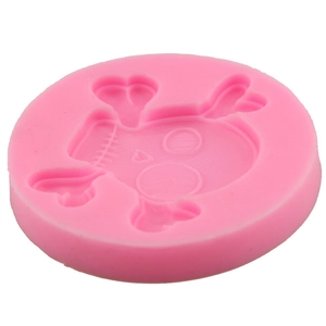 Pink silicone skull and crossbones mold for DIY Halloween chocolate or cake baking