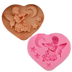 Macro detail of heart-shaped silicone mold featuring a fairy playing violin and crescent moon