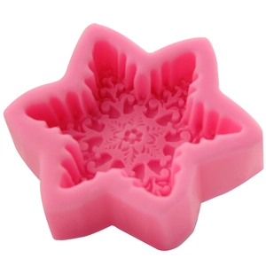 Pink silicone snowflake soap mold with detailed hexagonal star pattern for DIY crafts