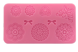 Pink silicone cake fondant mold with butterfly, flower and heart lace embossing shapes