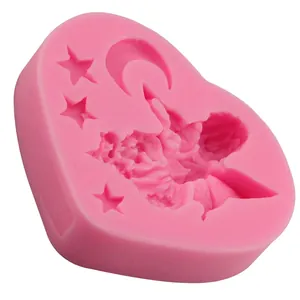 Pink heart-shaped silicone mold featuring stars, moon and angel for fondant or chocolate