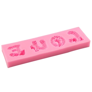Pink silicone mold featuring LOVE letter shapes for fondant and cake decoration