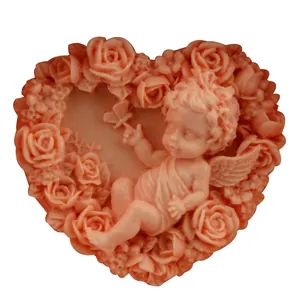 Pink heart-shaped silicone mold featuring embossed sleeping angel and rose floral pattern
