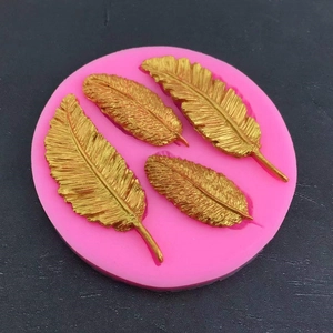 Pink silicone feather mold for DIY fondant and resin crafts featuring four diverse sizes