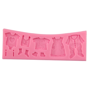 Pink silicone fondant mold featuring baby clothes designs for cake decoration