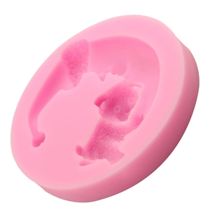 Pink 3D silicone mold for moon bear fondant and cake decorating on a white background