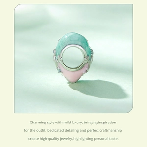 Detailed view of S925 sterling silver heart bead with pastel enamel and floral motifs