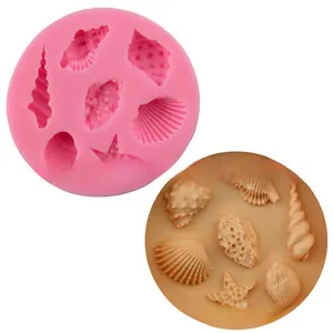 Detail view of pink silicone mold featuring starfish and seashell patterns for DIY baking