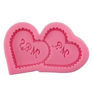 Pink heart-shaped silicone mold with MR and MRS lettering for DIY cake baking and crafts