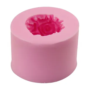 Macro detail of a pink silicone mold with intricate rose flower patterns for cake decorating