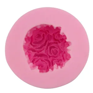 Pink silicone round mold featuring detailed 3D rose bouquet pattern for cake fondant