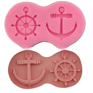 Detail of pink silicone mold with nautical anchor and ship rudder shapes for cake decorating