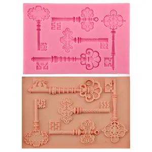 Detailed pink silicone mold for vintage key-shaped fondant and DIY baking decorations