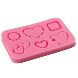 Pink silicone heart and rectangle molds for fondant cake decorating and DIY baking