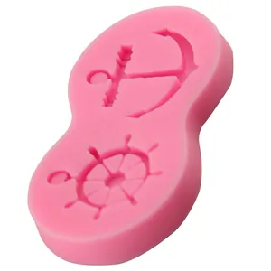 Pink silicone cake mold featuring anchor and bow patterns for DIY baking and fondant decor
