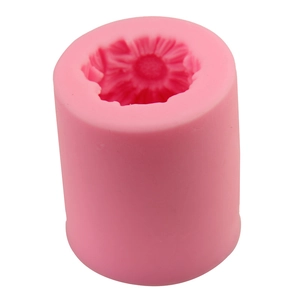 Pink silicone sunflower cylinder mold for soap and fondant cake decoration shown at a 45-degree angle