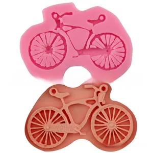 Detailed bicycle shaped silicone fondant molds in pink and red for creative DIY cake baking
