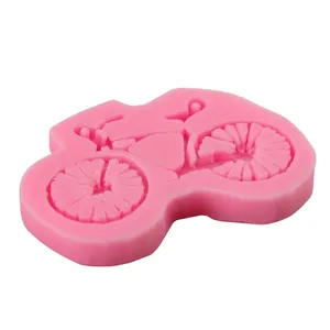 Pink bicycle-shaped silicone fondant mold for DIY cake decorating and crafts