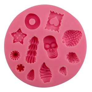 Pink silicone mold featuring cupcake, star, heart, and donut shapes for DIY clay and baking