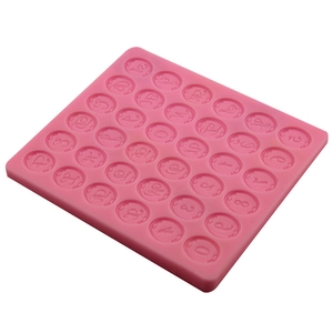 Pink silicone mold for baking with 30 round cavities featuring letters and numbers