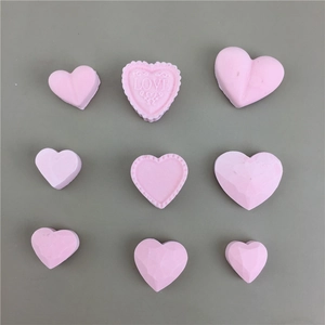 3D heart silicone mold for resin jewelry showing nine varied pink DIY pendant designs