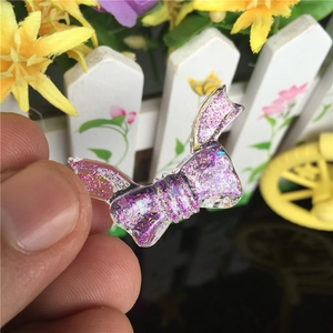 Translucent bow silicone mold with pink glitter for DIY resin craft jewelry making