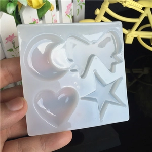 Translucent silicone mold for DIY resin crafts featuring moon, bow, heart, and star shapes