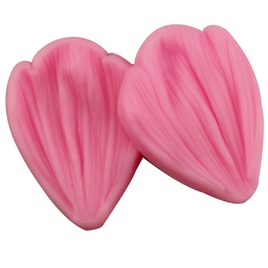 Pink silicone fondant mold with detailed leaf petal textures for professional cake decorating