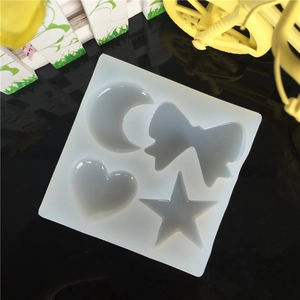 Translucent silicone DIY mold featuring star, moon, bow, and heart shapes for resin art